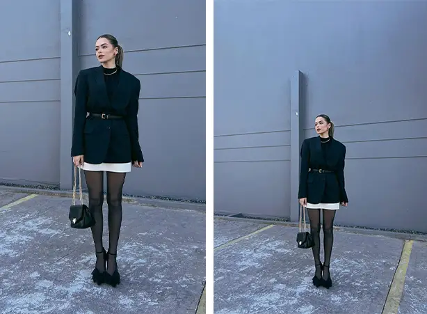 Look de saia branca com meia-calça preta com salto scarpin preto