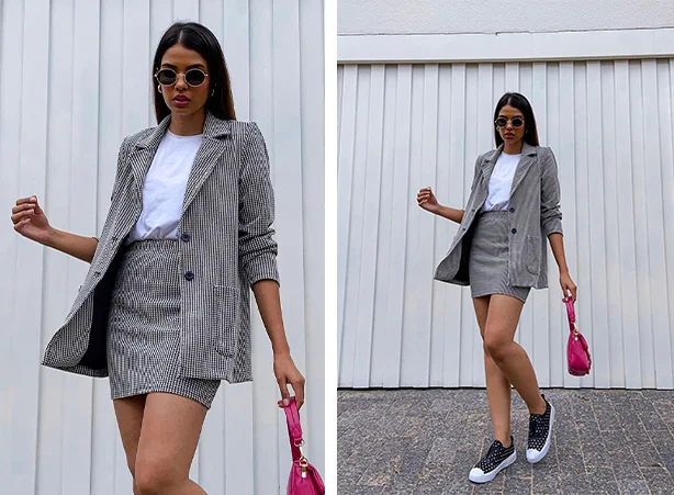 Look de conjunto de blazer com saia e tênis preto